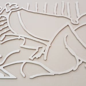 CNC cut Birch Plywood wall art showing a naked lady laying down