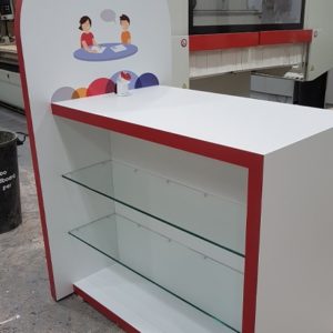 Red and white laminated bespoke point of sale display made for IDA Institute