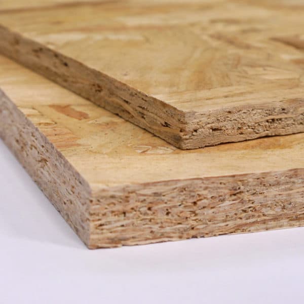 A photo showing two pieces of OSB Board, one on top of the other, the bottom panel is 18mm thick OSB, the top panel is 11mm thick OSB.