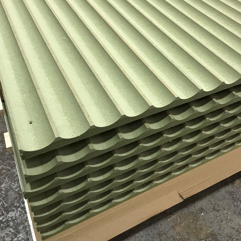 A stack of seven fluted moisture resistant MDF cut on a CNC router