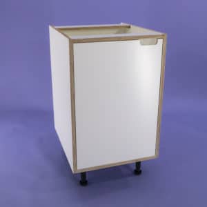 A studio photo of a white melamine faced birch plywood kitchen base unit with an inset door with a cut out handle design