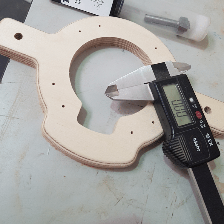Birch Plywood component cut to shape with Vernier callipers and a router bit