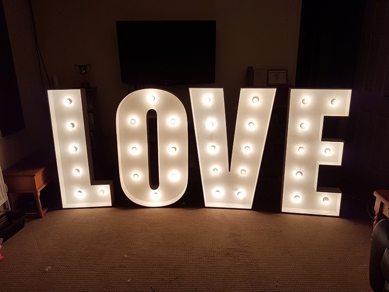 Freestanding Hollywood style illuminated letters LOVE for wedding reception feature