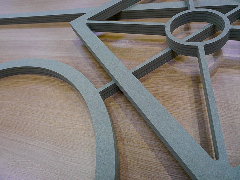 CNC routered moisture resistant frames for a bespoke glass cabinet doors