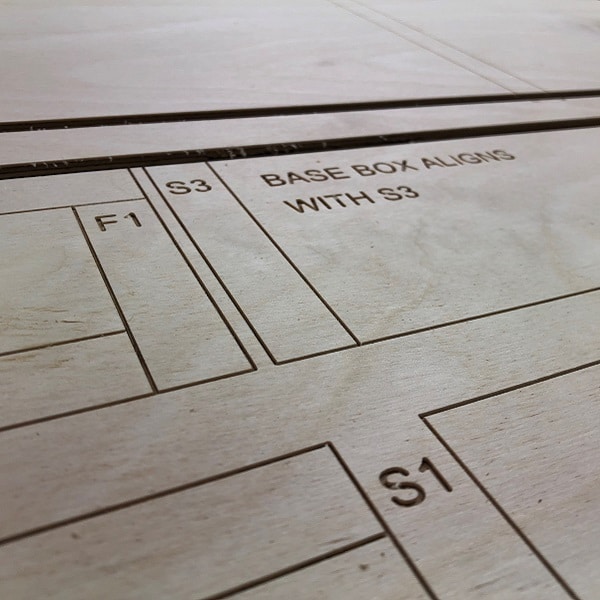 A Birch Plywood panel that has been cut and engraved on a CNC router