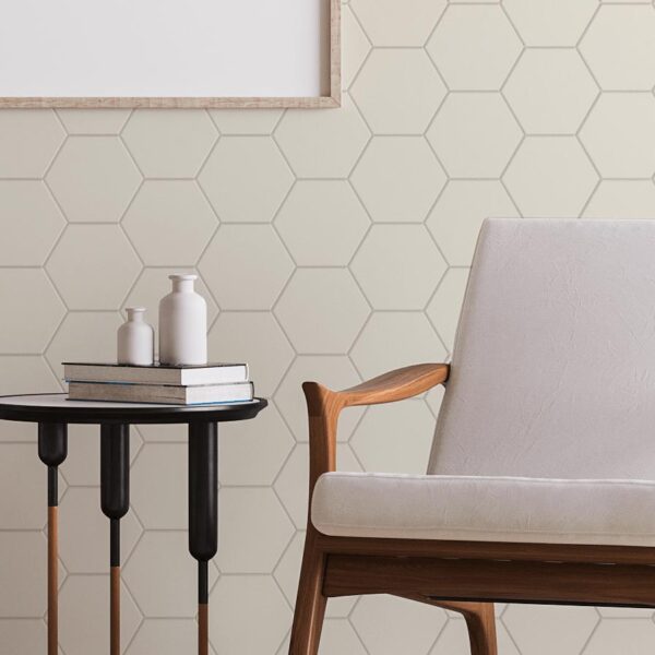 Hex Wall Panelling In Beige with a chair and a small coffee table in front