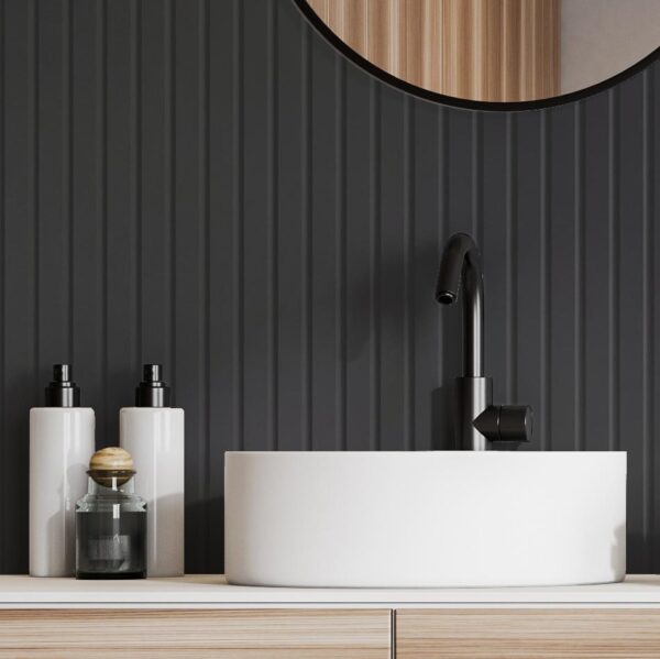 V Groove bathroom wall panelling in black with a sink and soap dispensers in front