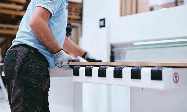 Veneered MDF being cut to size on a beam saw