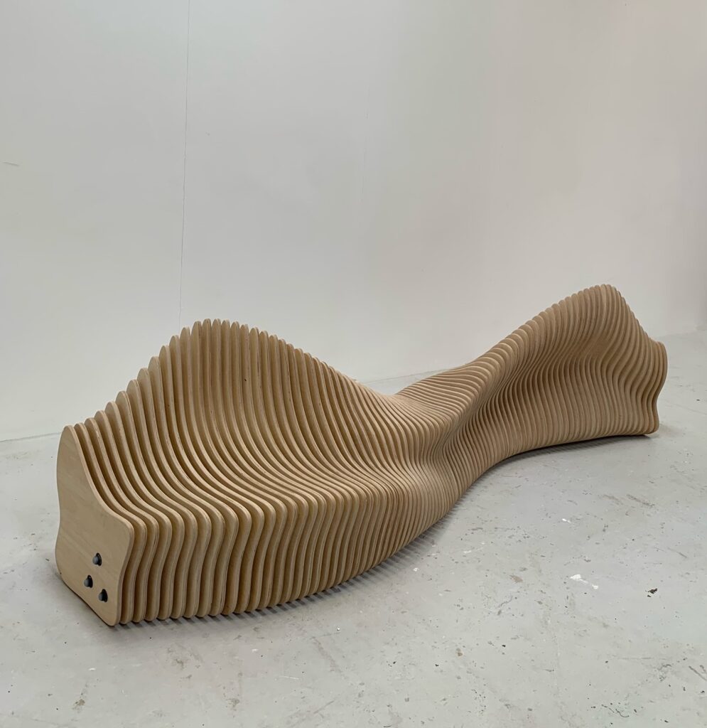 Parametric birch plywood bench in a workshop