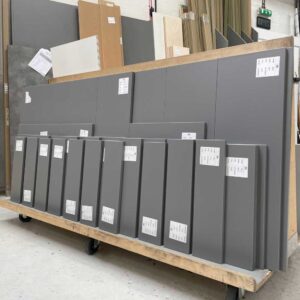 finsa gris tormenta panels cut to size and edged in a workshop