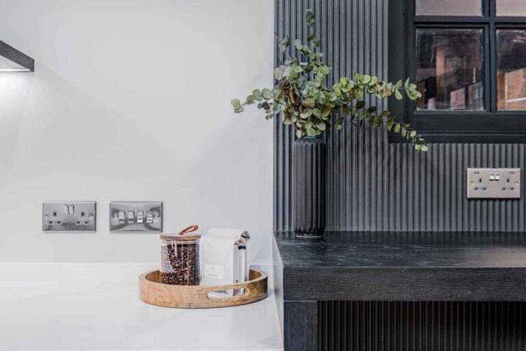 black mini fluted wall panelling communal area