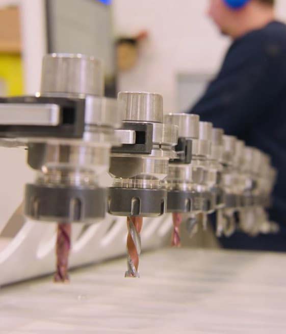 a close up image of cnc drills on a cnc machine