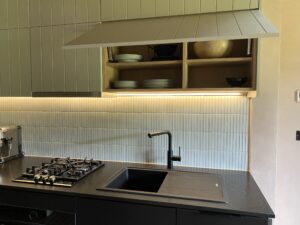 green painted tongue and groove panels as kitchen drawer fronts