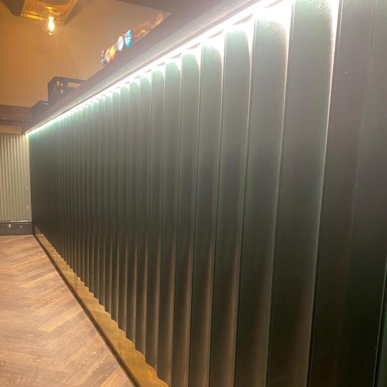 Large Fluted 3d tongue and groove mdf panelling on a bar front with led lights