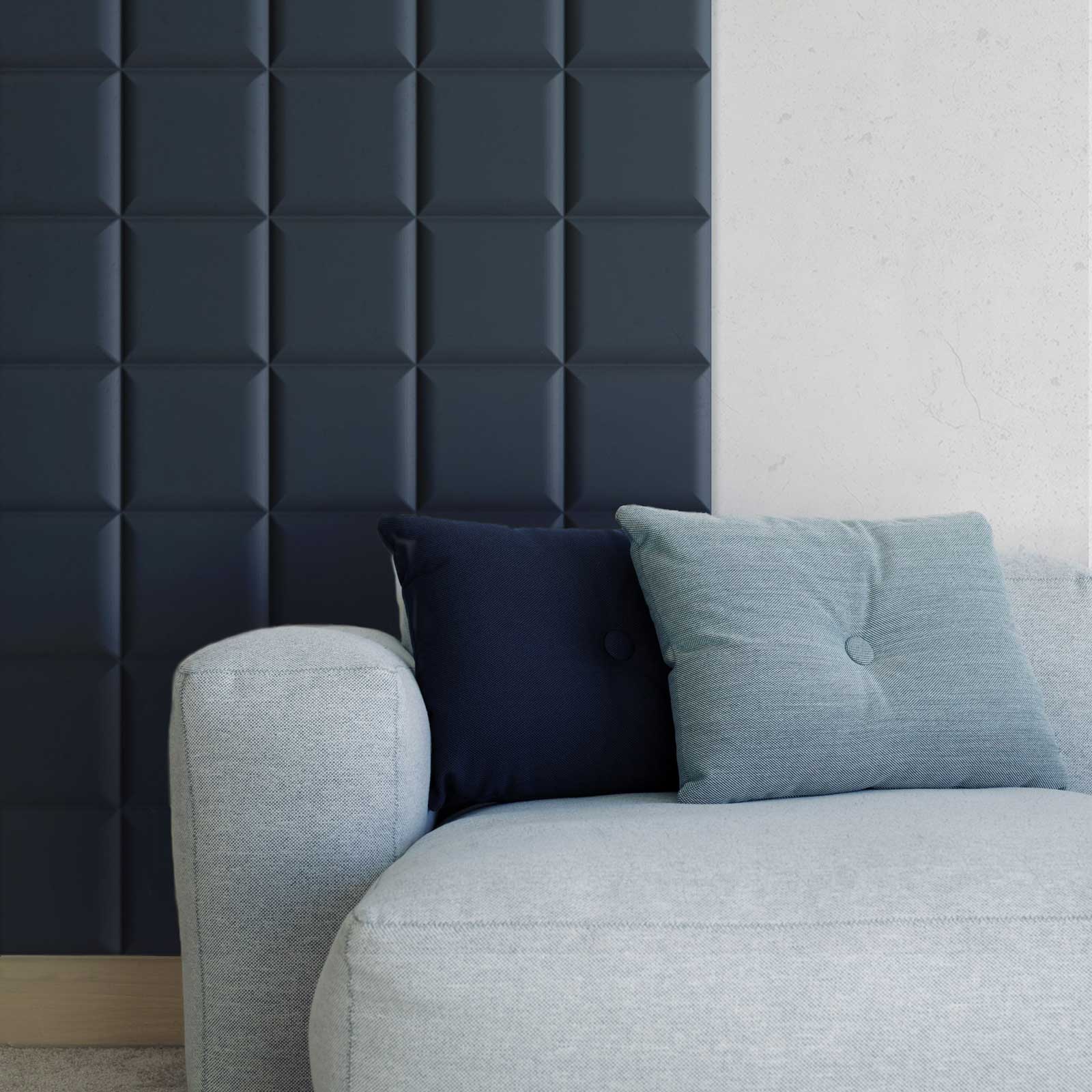 square padded mdf wall panels painted in navy blue behind a sofa